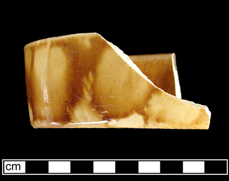 Federal Reserve Site - Unidentified oval shaped hollow vessel, probably a nappie, Rockingham glaze on buff-bodied earthenware. (side and top view.)